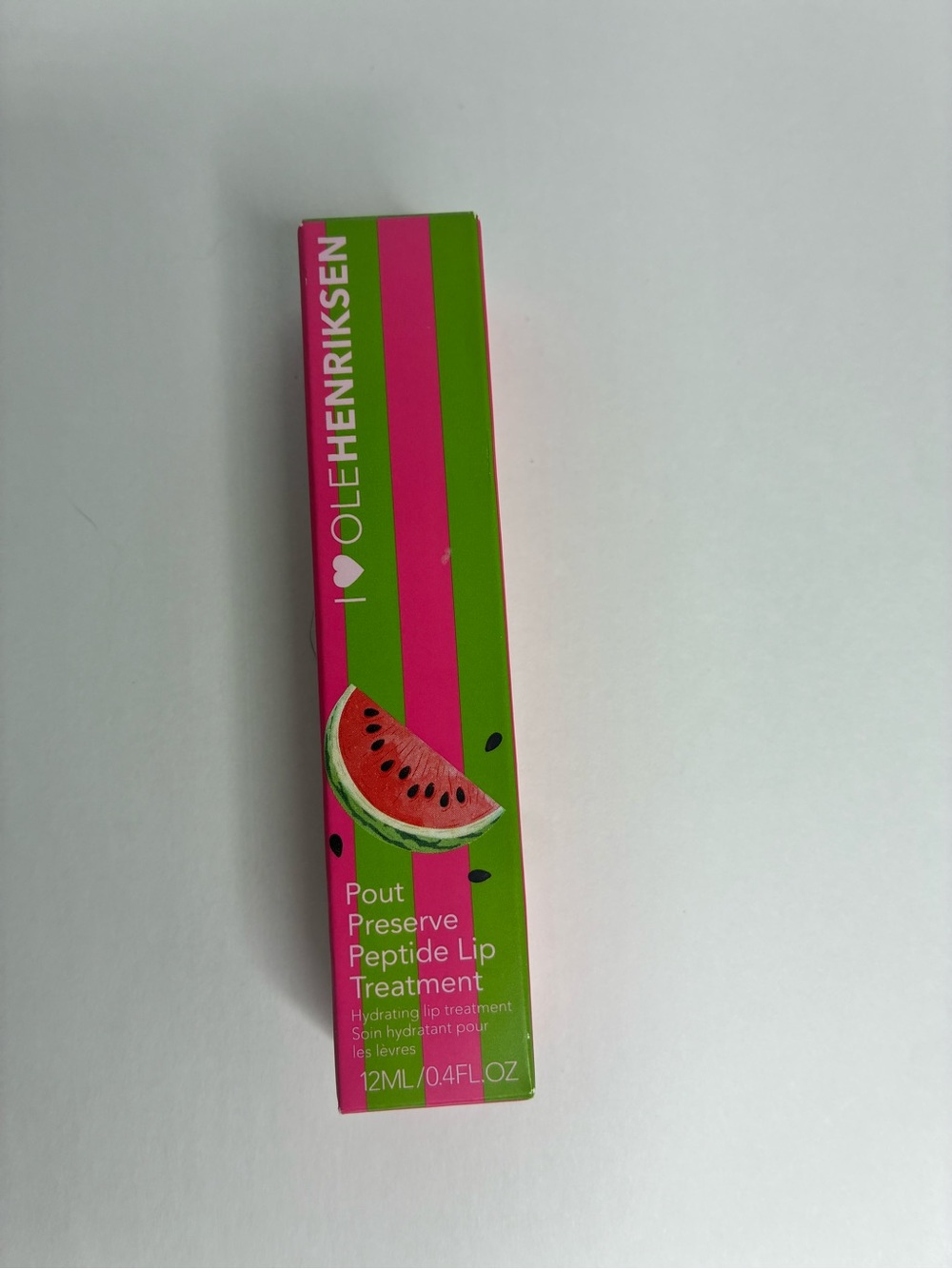 Ole Henriksen Lip Treatment in Pink and Green Striped Packaging